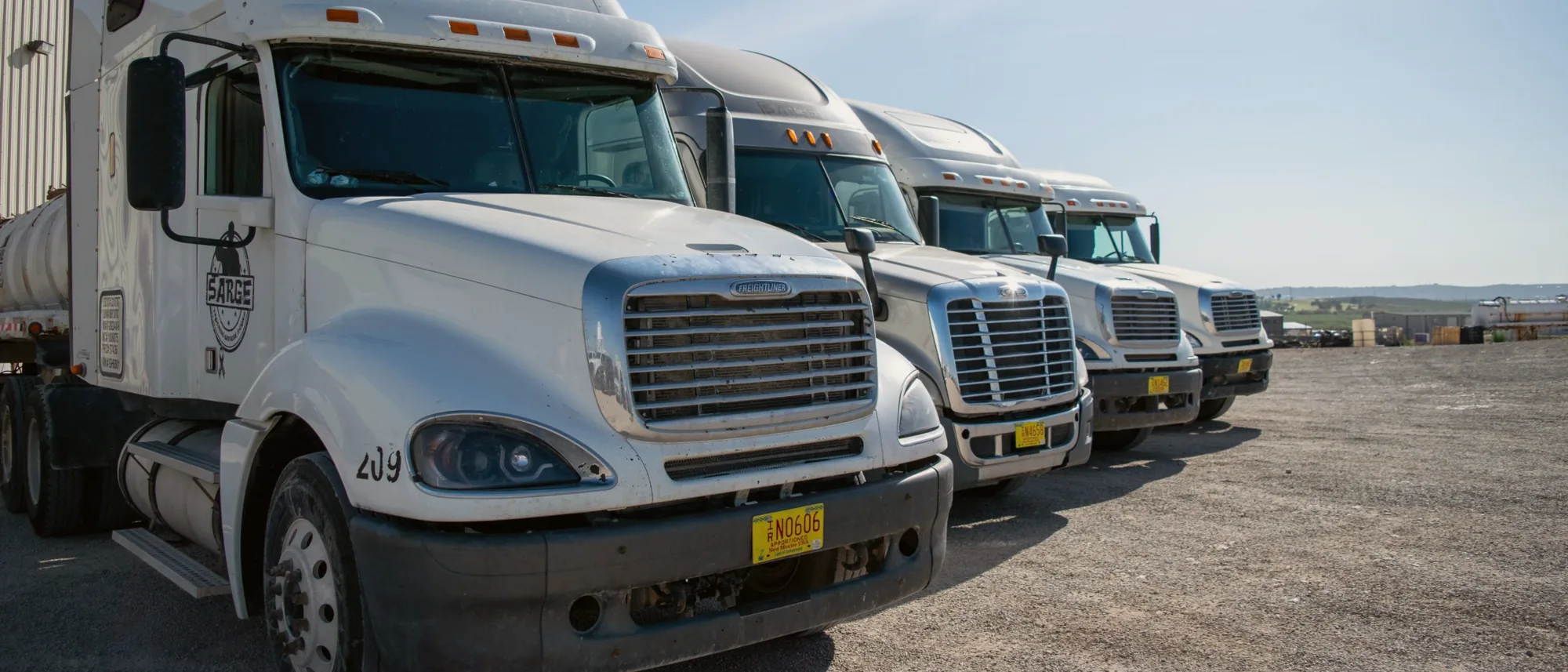 Sarge Freightliner trucks lined up in the yard