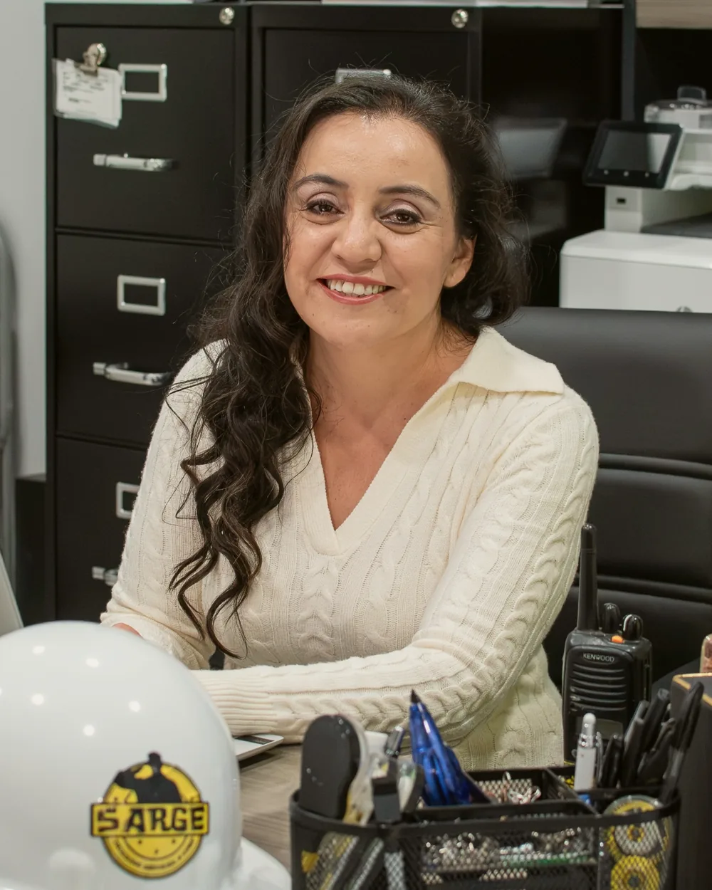 Portrait of Claudia Gomez, CFO, at her desk